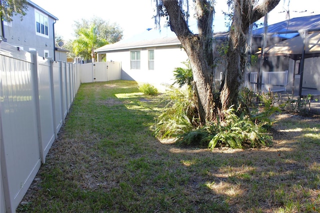 view of yard featuring a lanai