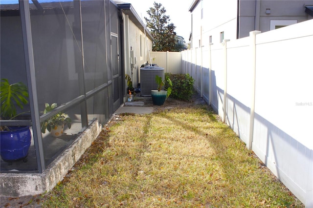 view of yard with central air condition unit