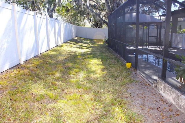 view of yard with a lanai