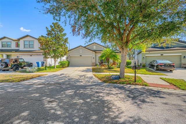 view of front of property featuring concrete driveway