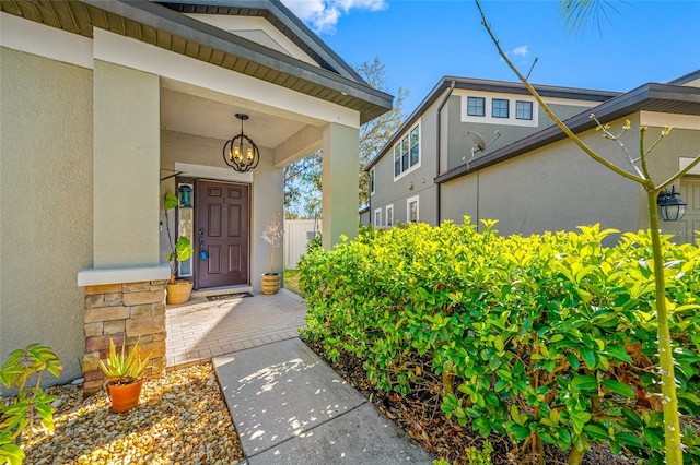 property entrance featuring stucco siding