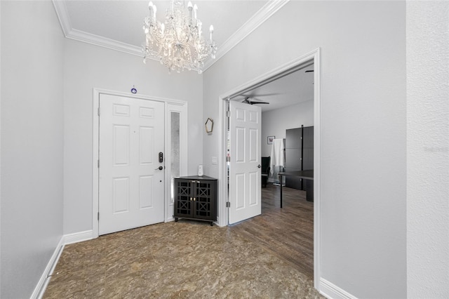 foyer featuring ornamental molding, baseboards, and an inviting chandelier