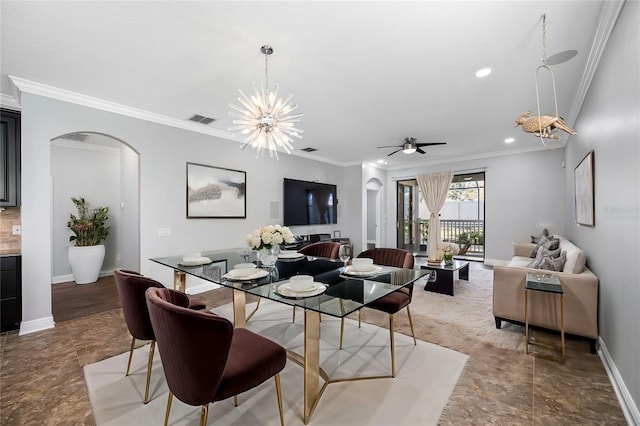 dining area featuring arched walkways, crown molding, recessed lighting, and baseboards