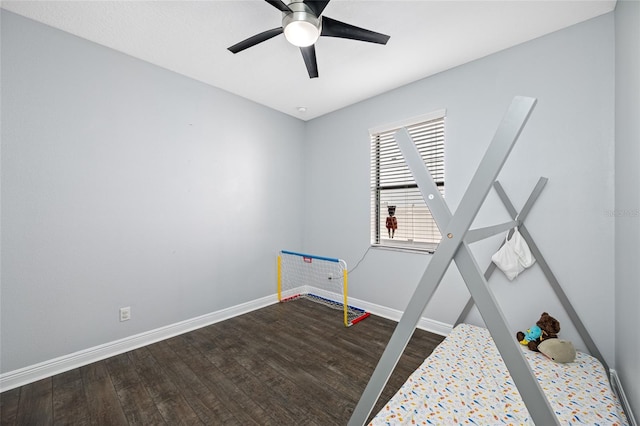 unfurnished bedroom featuring a ceiling fan, baseboards, and wood finished floors