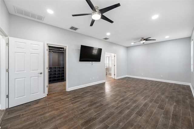 unfurnished living room with recessed lighting, dark wood-style flooring, and visible vents