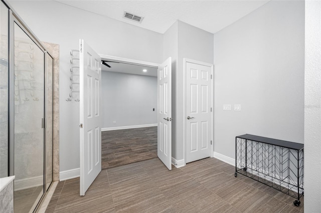 corridor with visible vents and baseboards