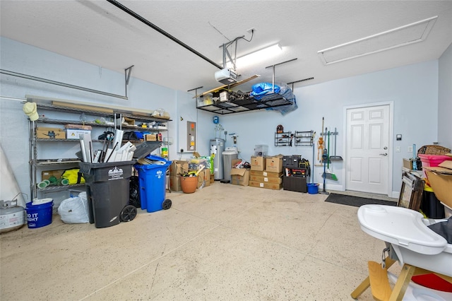 garage featuring electric panel and a garage door opener