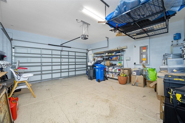 garage with electric panel and a garage door opener