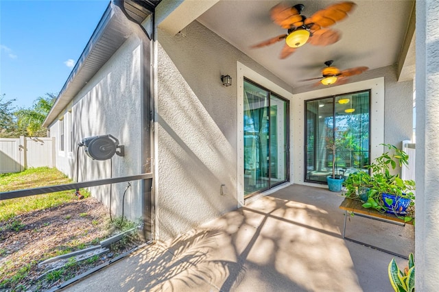 exterior space featuring ceiling fan and fence