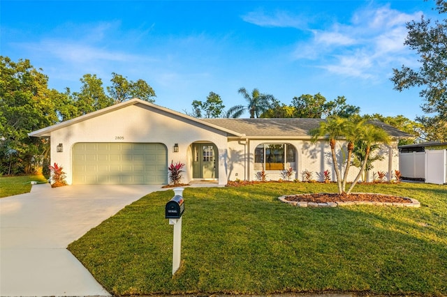 ranch-style house with a front yard and a garage