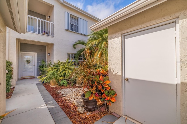 entrance to property with a balcony