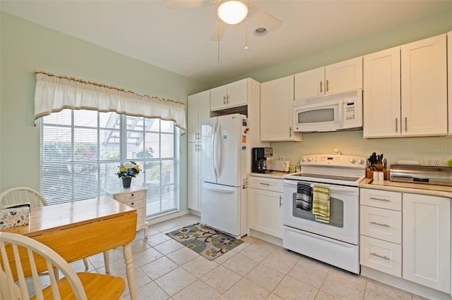 kitchen with ceiling fan, light tile patterned floors, white cabinets, and white appliances