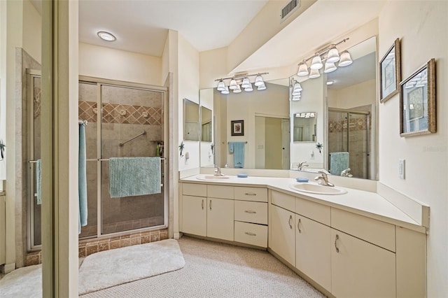 bathroom with vanity, tile patterned floors, and an enclosed shower