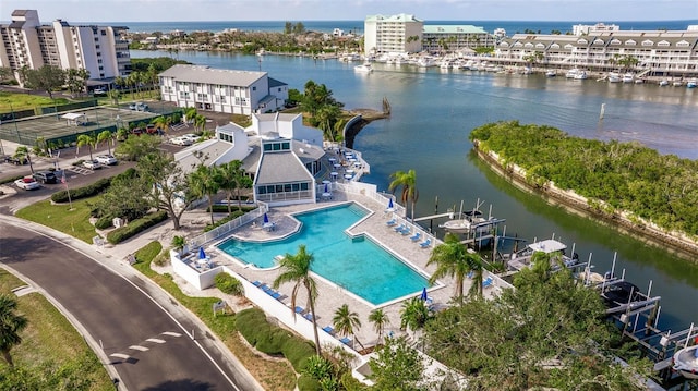 birds eye view of property with a water view