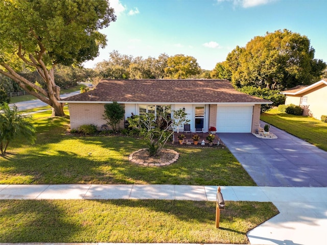 ranch-style home featuring a front yard and a garage