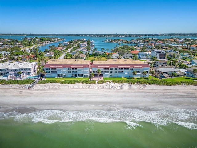 birds eye view of property featuring a water view and a view of the beach