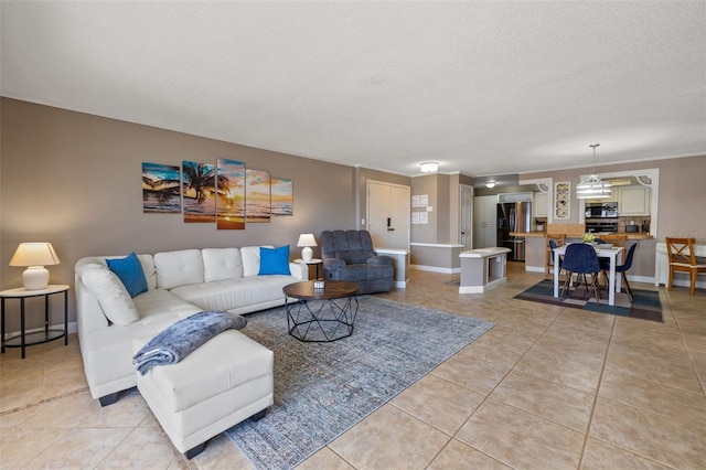 living room featuring crown molding, light tile patterned flooring, and a textured ceiling