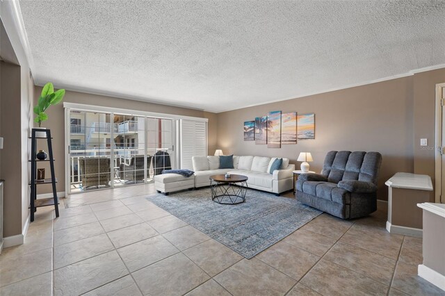 tiled living room with a textured ceiling and ornamental molding