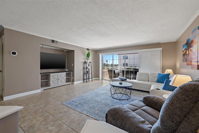 tiled living room featuring a textured ceiling and crown molding