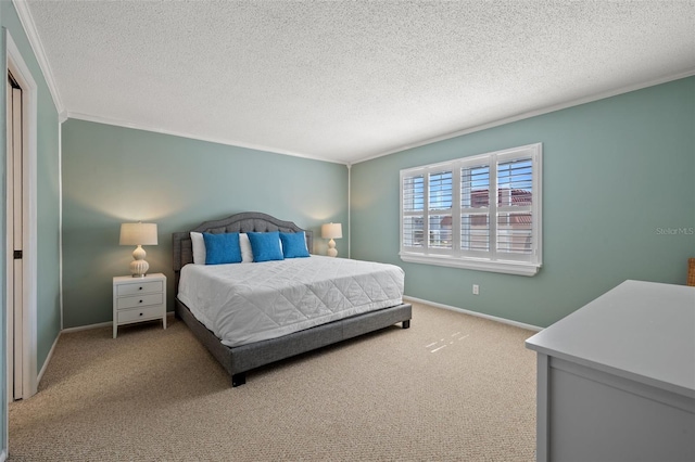 bedroom with a textured ceiling, carpet floors, and ornamental molding