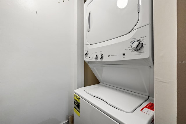 washroom with stacked washer and clothes dryer