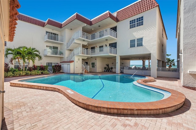 view of swimming pool with a patio