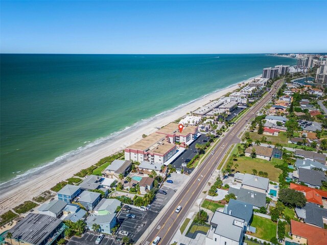 bird's eye view featuring a view of the beach and a water view