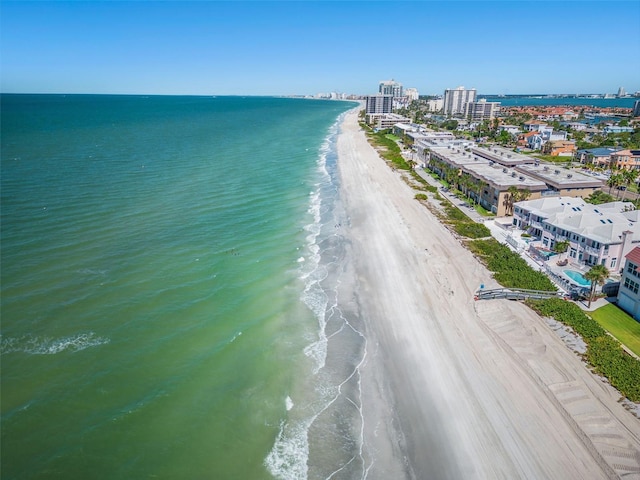 drone / aerial view with a water view and a view of the beach