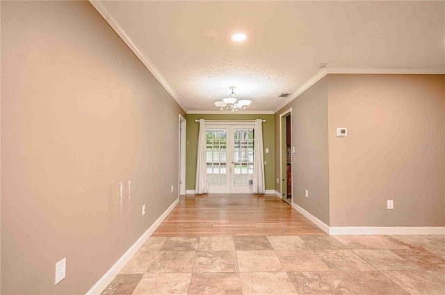 interior space featuring french doors, an inviting chandelier, crown molding, a textured ceiling, and light wood-type flooring