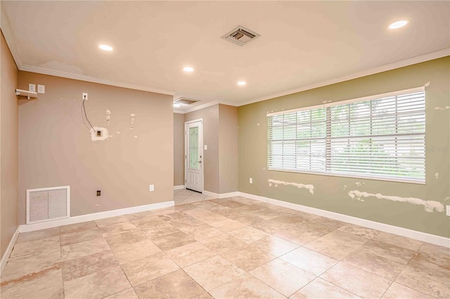 spare room with crown molding