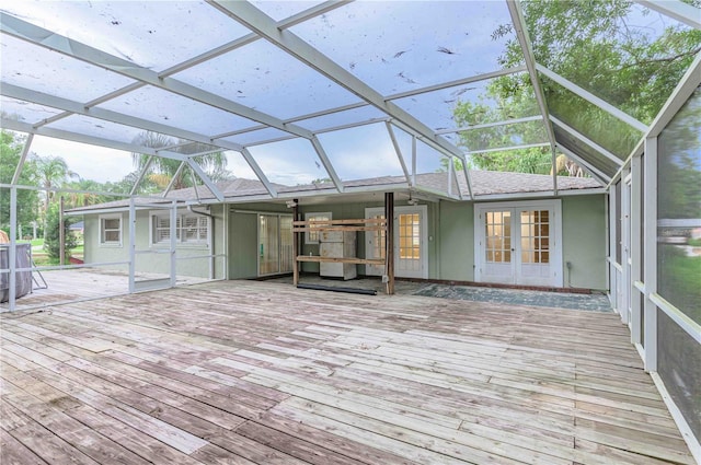 unfurnished sunroom with french doors