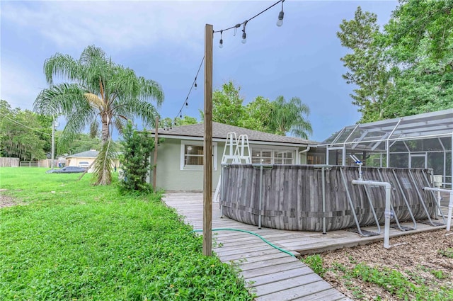 view of yard featuring a lanai and a deck