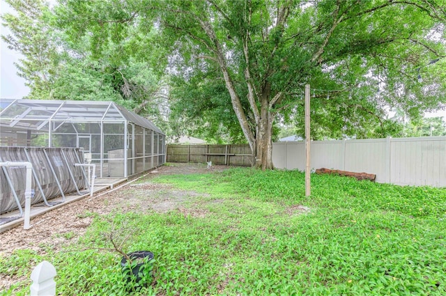 view of yard featuring a lanai