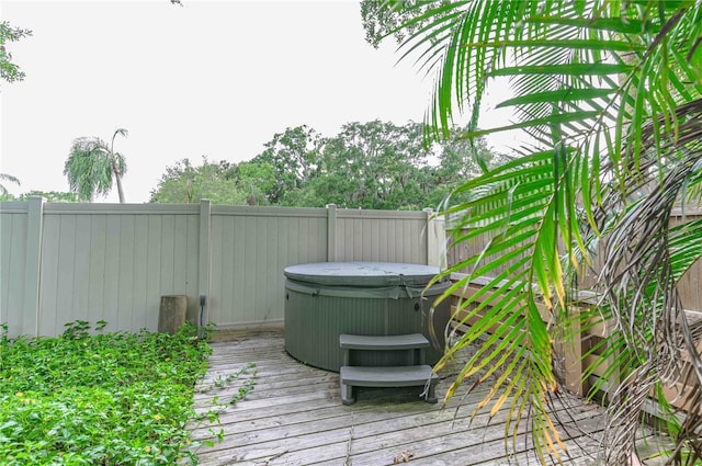 deck with a hot tub