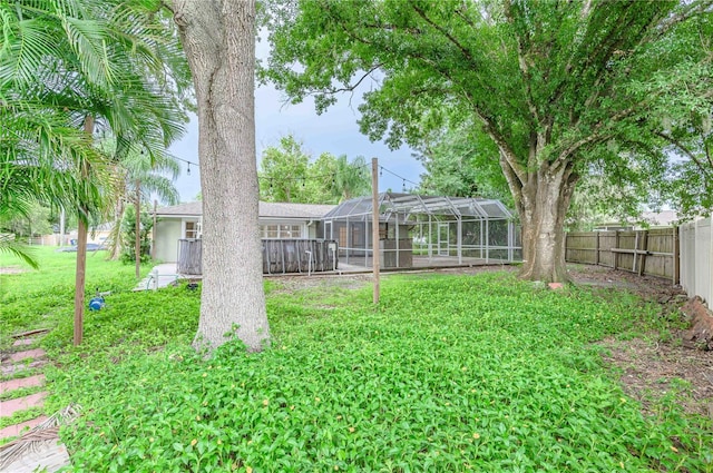 view of yard with a lanai