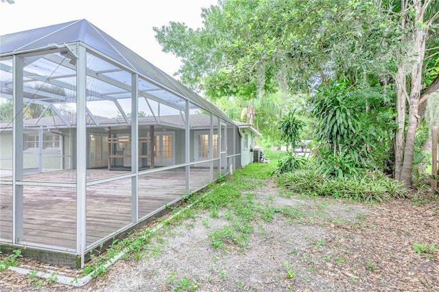 view of side of home with a lanai