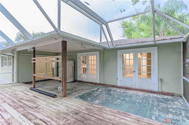 unfurnished sunroom with french doors