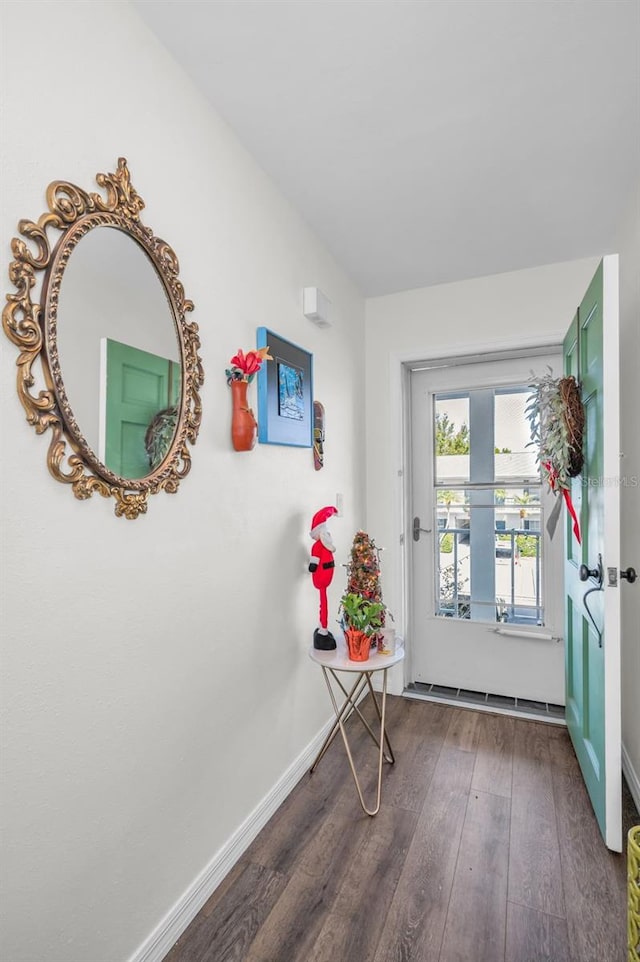 doorway to outside featuring dark hardwood / wood-style flooring