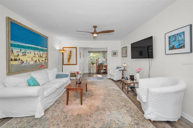 living room with ceiling fan and wood-type flooring