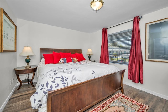 bedroom featuring dark wood-type flooring