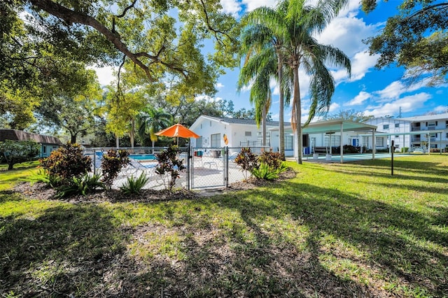 view of yard featuring a community pool