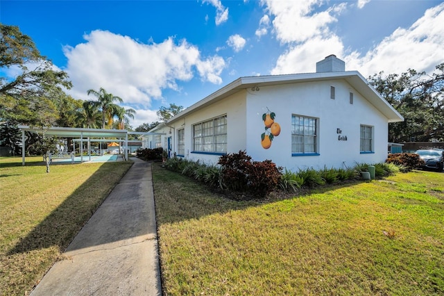 view of side of home featuring a yard