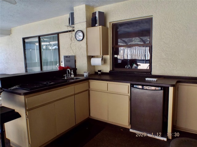 kitchen with dishwasher, cream cabinets, sink, a textured ceiling, and kitchen peninsula