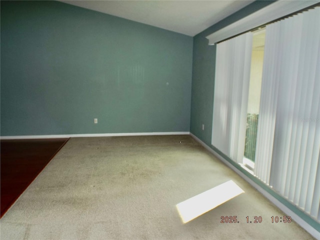 unfurnished room with carpet floors