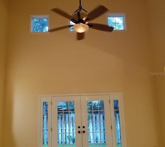 interior details with french doors and ceiling fan