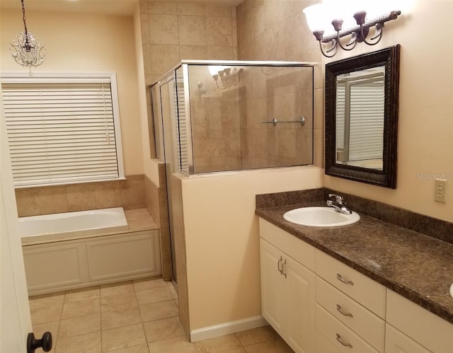 bathroom featuring tile patterned flooring, shower with separate bathtub, and vanity