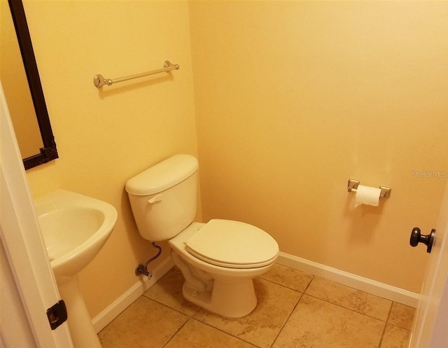 bathroom featuring toilet and tile patterned floors