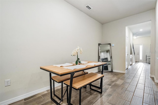 dining area featuring wood-type flooring