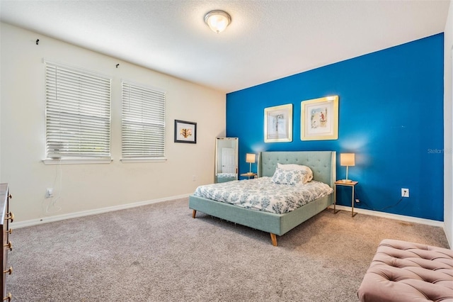 carpeted bedroom with a textured ceiling