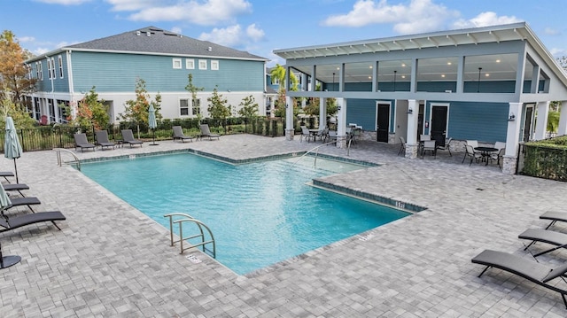 view of swimming pool with a patio area